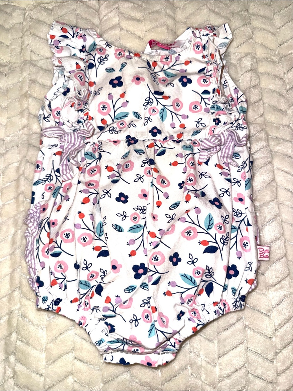 Ruffle Butts floral patterned white baby romper, size 6-12 mos